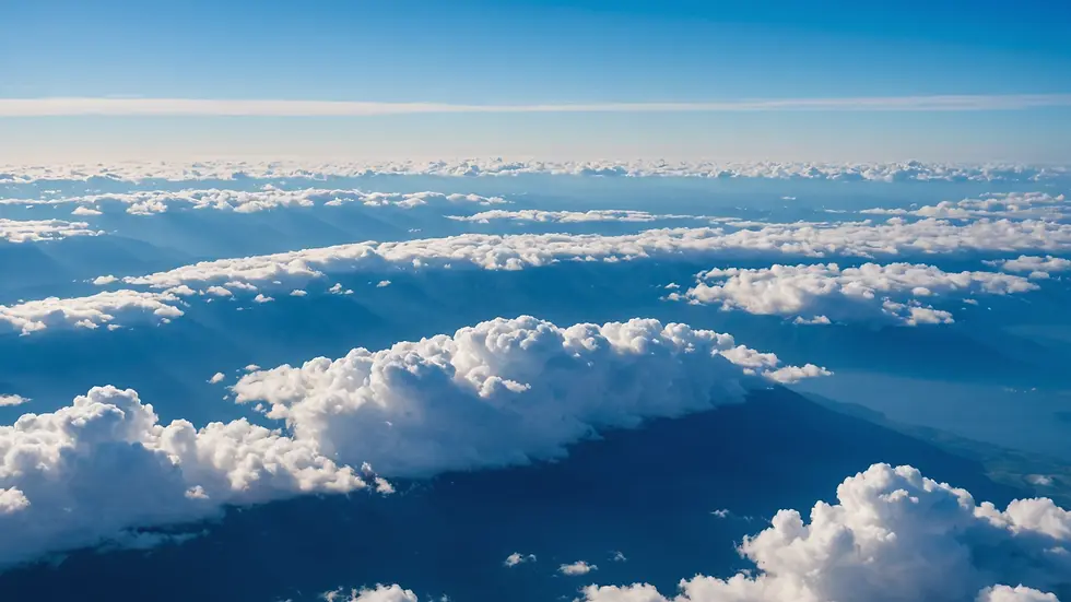 High angle view of clear blue sky with scattered clouds