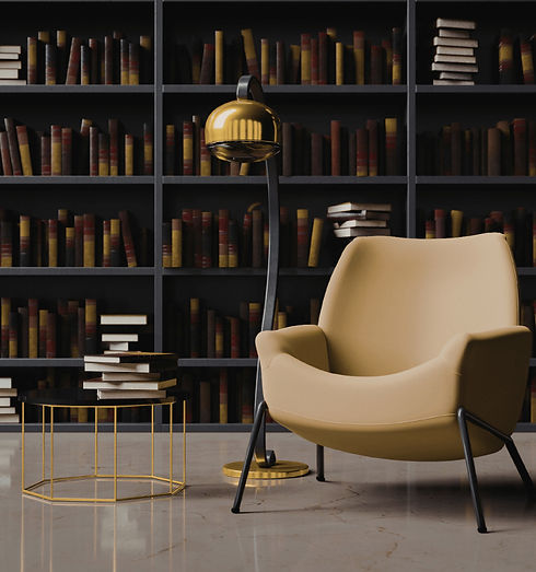 Professional office interior with bookshelf, armchair, lamp, and stacked books