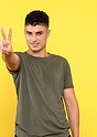 front-view-smiling-guy-shows-fingers-his-hand.jpg
