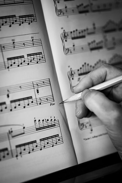 hand pencil writing on music score b&w.jpg