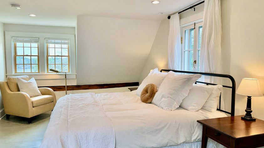 This spacious room features king bed and lovely water views!