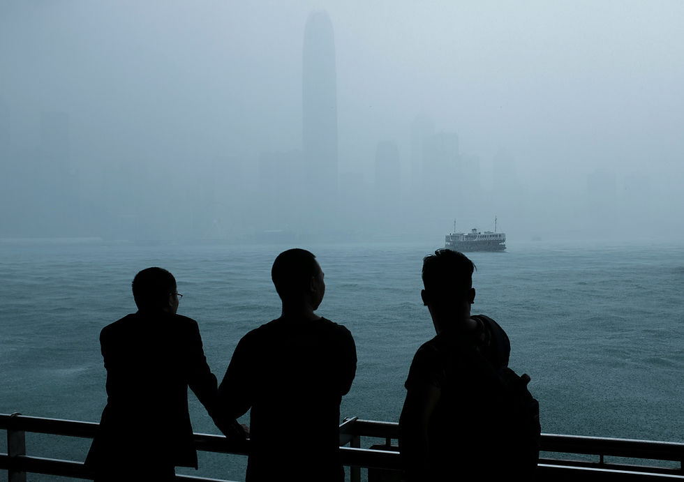 Tourists are enjoying the view at the pier while storm is coming at Hong Kong, 2019