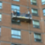 Workers performing brick restoration services on-site in Toronto.