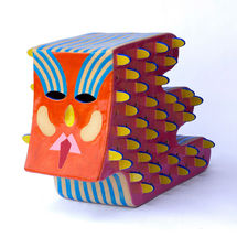 Ceramic Faces with hidden worlds on the inside.