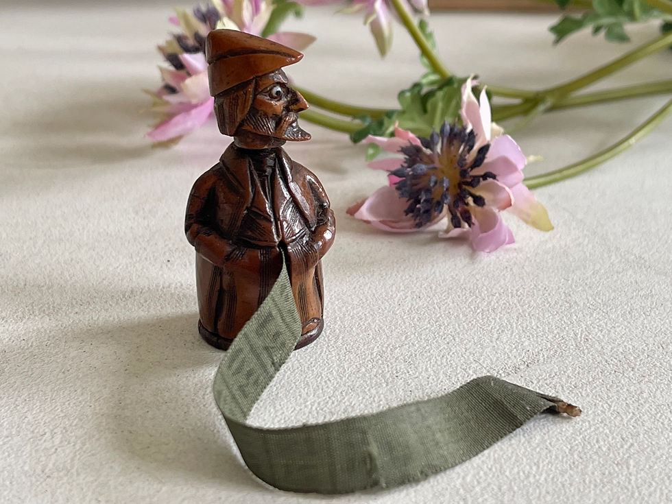 antique coquilla nut figural tape measure