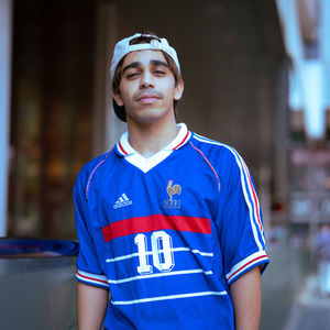 Portrait of a man wearing a France 1998 home shirt with Zidane No.10 in Osaka, Japan.