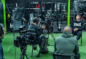 Team at AA video production filming a training interview video at a gym
