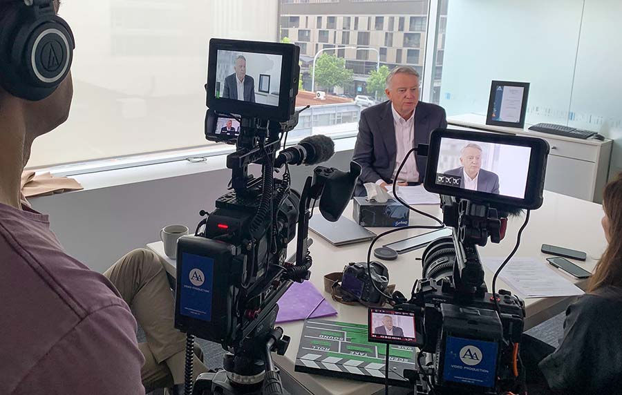 AA Video Production crew recording a two-camera corporate interview in a South Australian office.