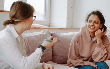 Woman talking with professional. Therapy isn't always accessible, and our skilled online therapists understand. Our student interns offer affordable therapy in Denver, CO. Learn more and try our sliding scale therapy options.