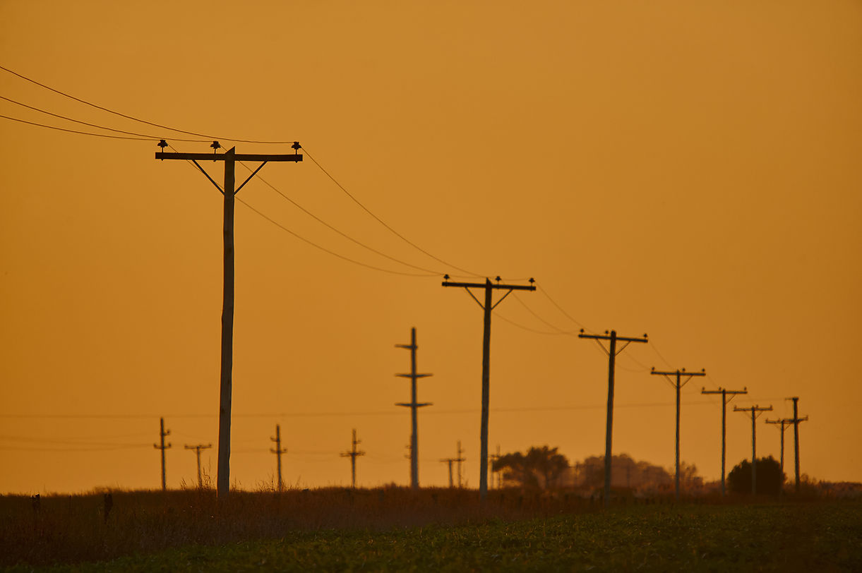 scenery-of-sunset-in-an-overhead-power-line-2023-11-27-05-07-00-utc.jpeg