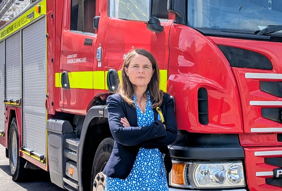 Vikki Slade MP stood with a Fire Engine