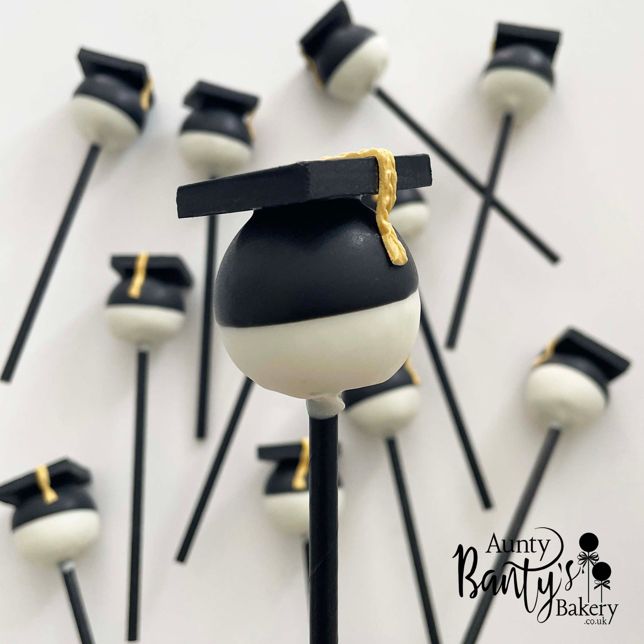 A close up of a graduation cap cake pop.
