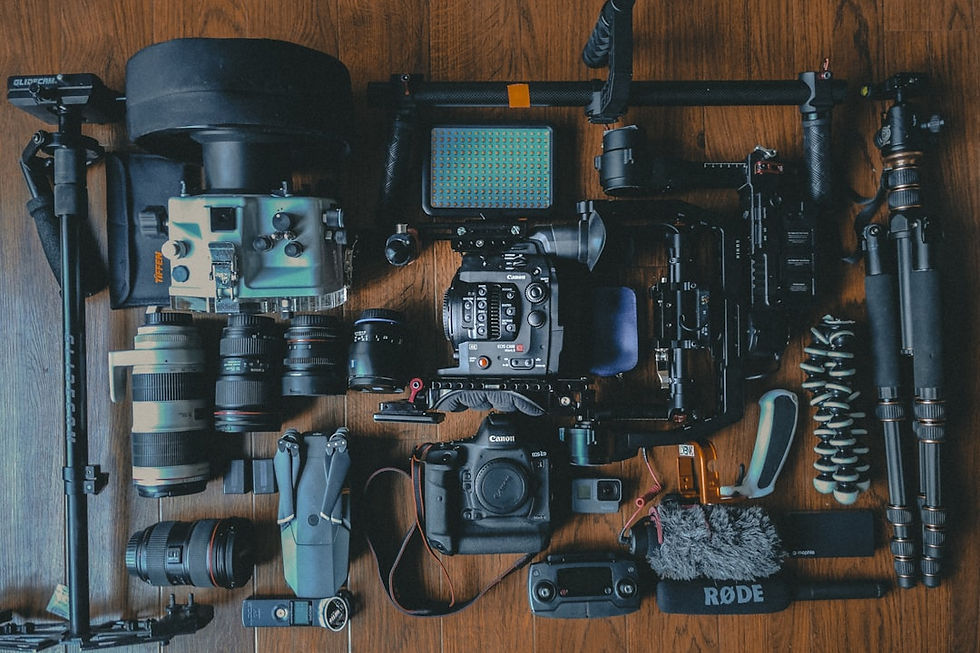 flat lay photography of cameras and camera gear