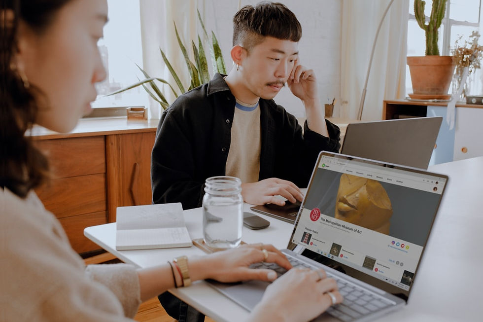 2 people sitting at table working