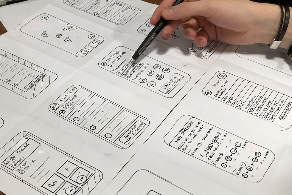 person holding pen near paper