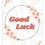 Thumbnail: Good Luck Card - "Good Luck" features a cherry blossom wreath and coral lettering over a subtle sunburst