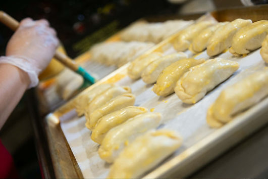 Mini Empanadas being brushed.jpg