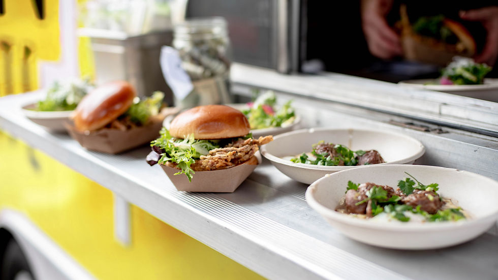 Eye-level view of a vibrant food truck in a bustling market scene