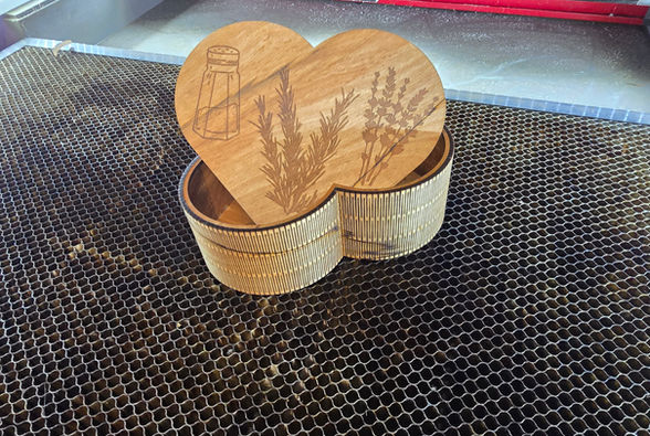 An engraved heart shaped wooden box