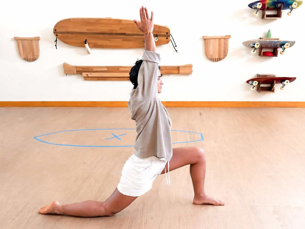A woman performing an integrated movements pose for after surf recovery