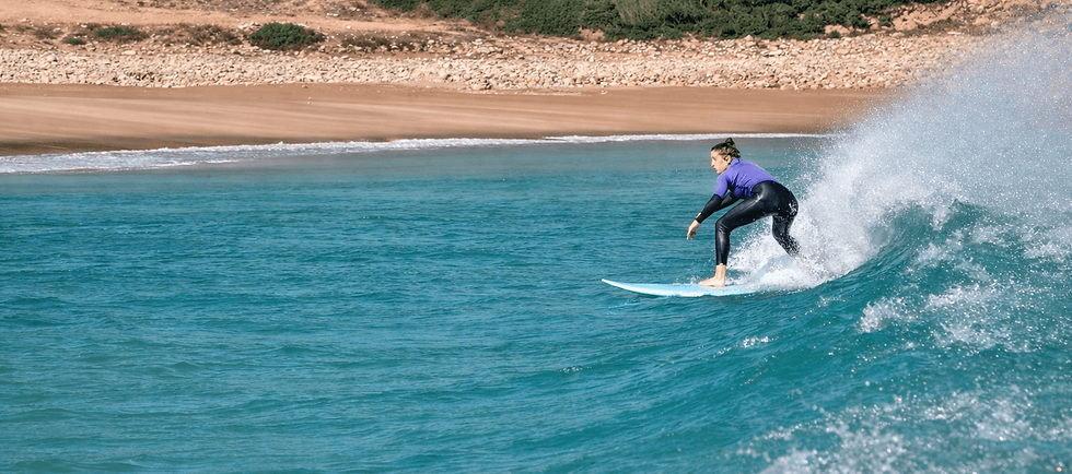Surfer on a turquoise wave