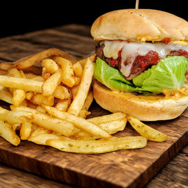 Flame broiled 1/2 pound house made patty basted in our homemade spicy sma furnace sauce, topped with melted jalapeno jack cheese and served on a split top bun with house made chipotle mayo, green leaf lettuce, tomato, red onion, and pickles. Served with seasoned french fries.