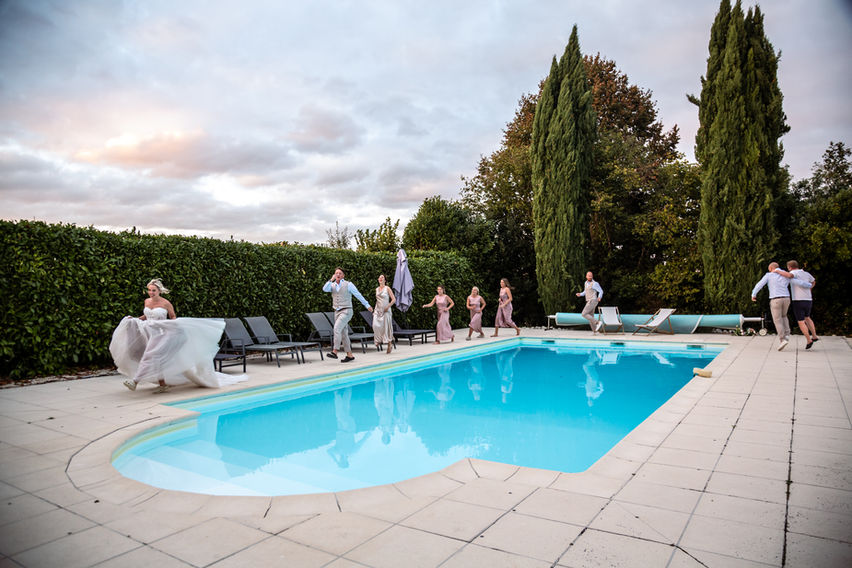 wedding photo in South West France with married couple friends in the pool