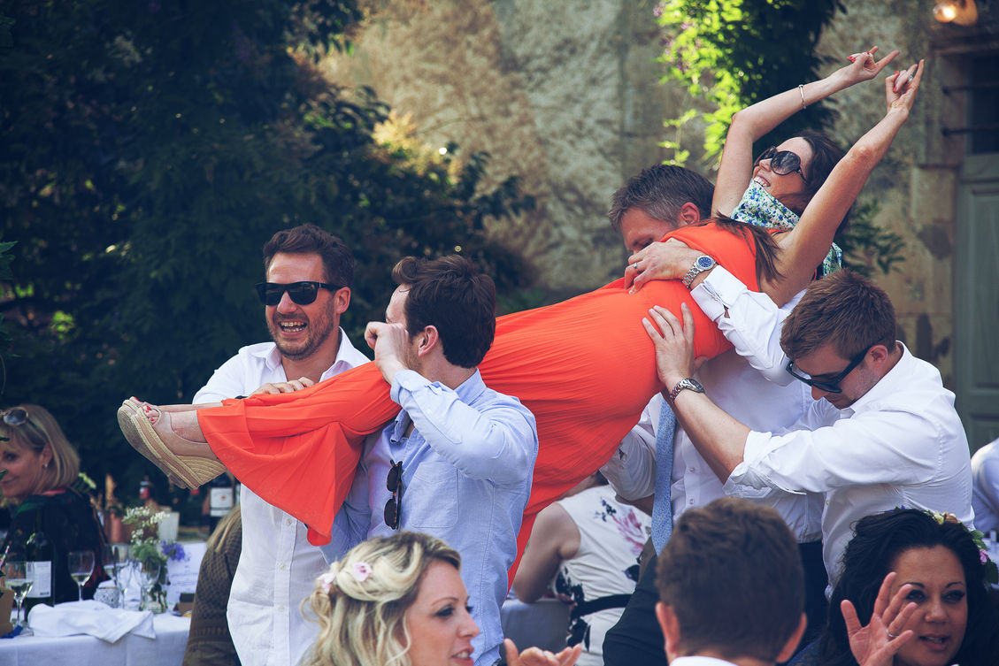 wedding photo in South West France with married couple friends - shaking the bride up