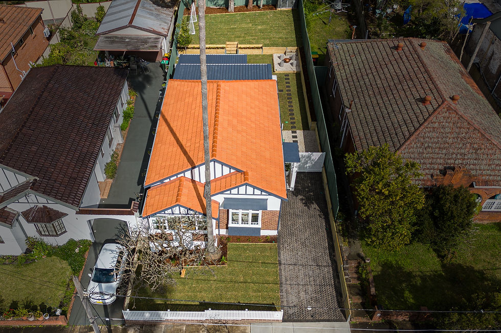 Aerial view of the renovated Summer Hill property with terracotta roof, landscaped front yard and dr