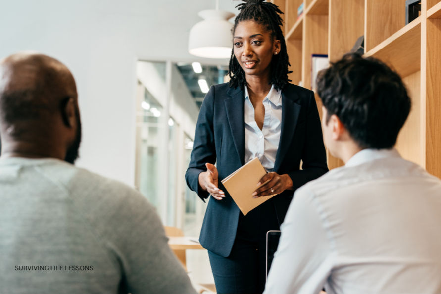 A woman presents her thoughts to colleagues.