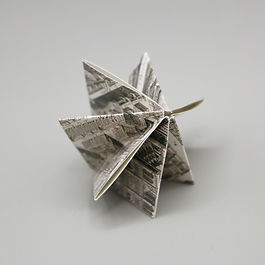 FOLDED STREETS and URBAN CREASES Digital Photography Maps of our surroundings take landforms of varying shape and present them on a flat surface. How does this change how we perceive the land we travel on? What happens when those forms of flat land we call maps are presented in new ways? What lies on the edge of the map? Folds create tension and separate what should effectively be conjoined. Right angles and straight edges compose our houses, our cities, and our maps. Reconstructions at small scales, maps give the ability to comprehend something large, as a form of manageable information... and more importantly in an organized manner. Map Fold: Urban Star 2 , 2023. Digital Photograph. Creases in a map create a new landscape of form in flat paper surfaces. Angled and folded, the information on the map becomes jumbled and incomprehensible. With that comes an abstracted view of a map detracted from it initial purpose. The harmony of patterns in maps create cropped features of emphasis, and obstruct or minimize by folding or creasing. Map Fold: Street Structure 2, Sepia Lines 1, City Folds 3, 2023. Digital Photographs.