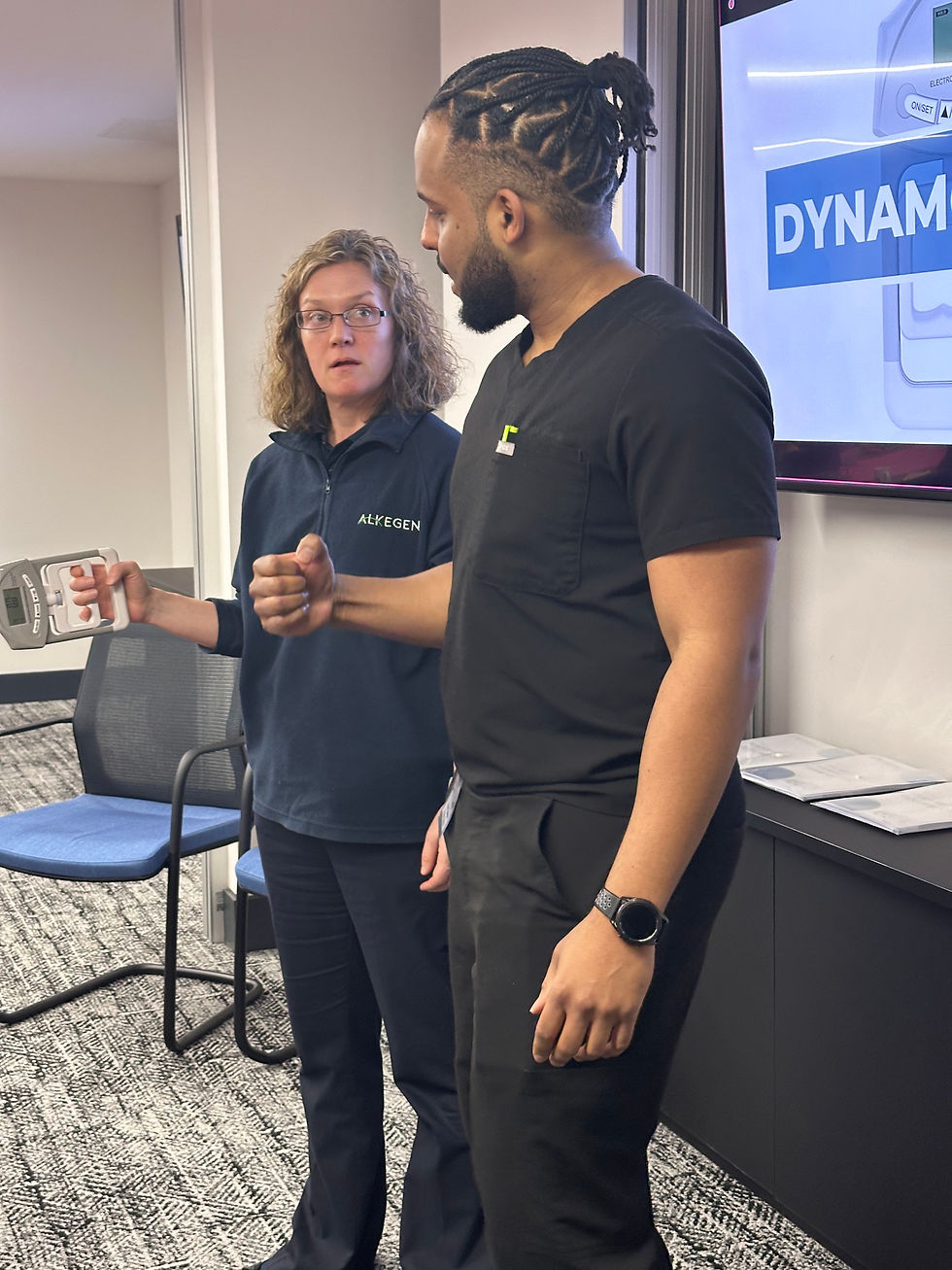 Dr Martin on womens health day demonstrating grip strength measurements and why women should train to build muscle for longevity