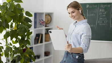 young-woman-teaching-students-english-class-online (1).jpg
