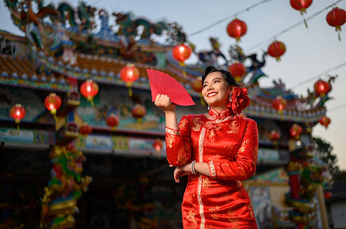 portrait-asian-beautiful-woman-wearing-cheongsam-smiling-holding-red-envelopes-fan-pose-sh