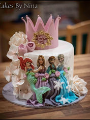 Beautiful single tier princess cake with pink crown on the top