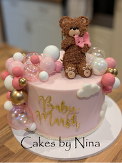 Baby Marsh cake with teddy bear topper and balloons