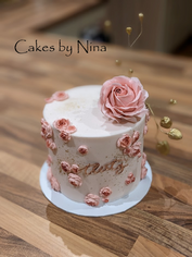 Cake with pink flower and decoration