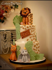Two tier with 3d handmade elephant, giraffe and lion on the top