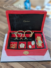 Red jewelry box cake with gold jewelry