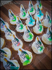 Cupcakes with champagne bottle toppers for a 21st birthday