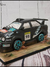 Subaru rally car cake with racing decals by Cakes By Nina