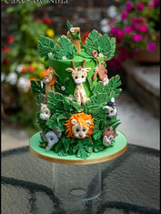 Colour and playful jungle cake with lots of greeny and cute little jungle animals