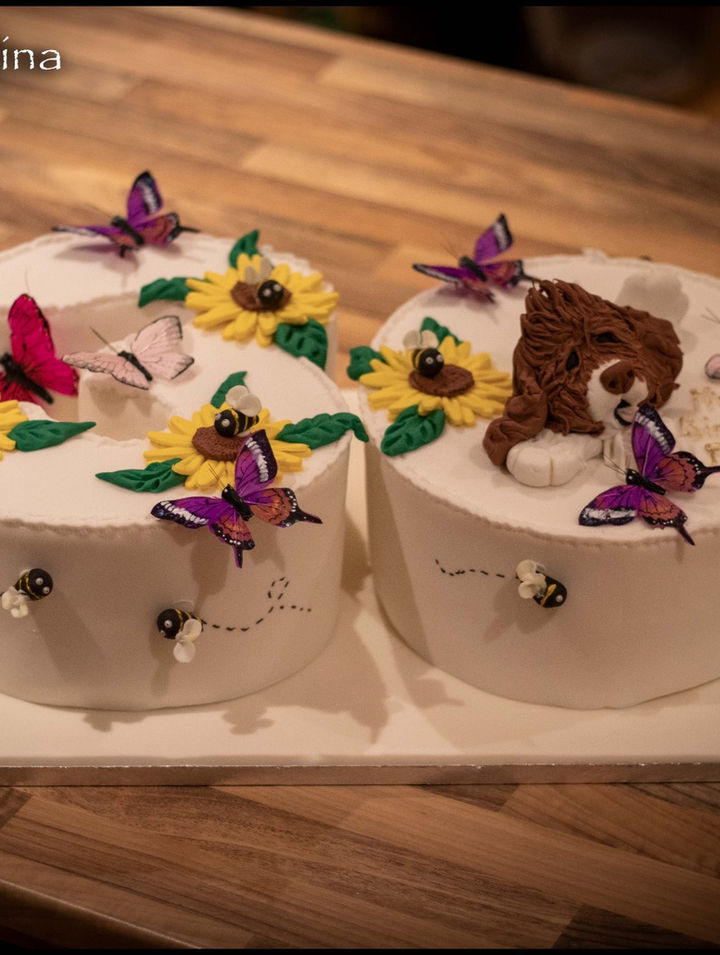 Tiered cakes decorated with butterflies and sunflowers