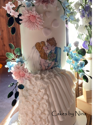 Beautiful romantic couple kissing on this wedding cake with sugar flowers