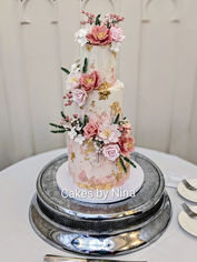 Wedding cake set up at The Elvetham - Blush pink and dusky pink background with gorgeous sugar flowers on this stunning wedding cake