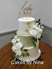 Beautiful sage green wedding cake with stunning sugar flowers