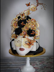 Artistic cake with a mask design.