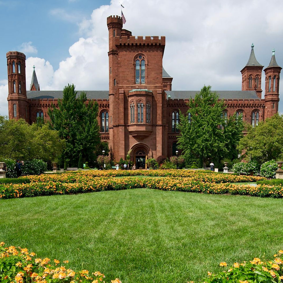Eye-level view of the National Air and Space Museum exterior with visitors entering
