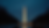 Eye-level view of the Washington Monument glowing at night