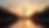 Eye-level view of the Lincoln Memorial reflecting pool at sunset